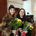 A photo of Liz and Deanna holding flowers