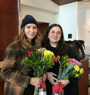 A photo of Liz and Deanna holding flowers