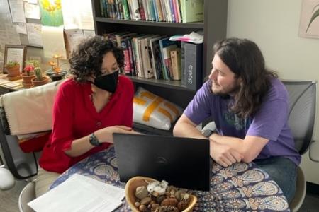 Dr. Barriga assisting a student in her office