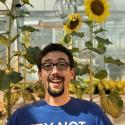 Dr. Daniel Jones of Auburn University smiles in front of a background of sunflowers